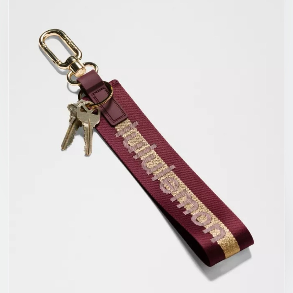 Lululemon NWT Never Lost Keychain (DELX/GOLD/BONE Color Code Burgundy Gold Bone